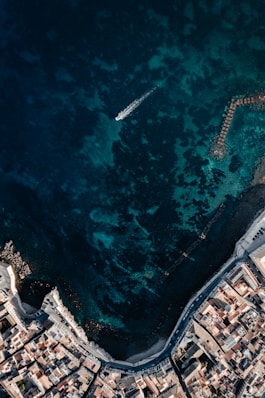 aerial view of white boat on sea during daytime