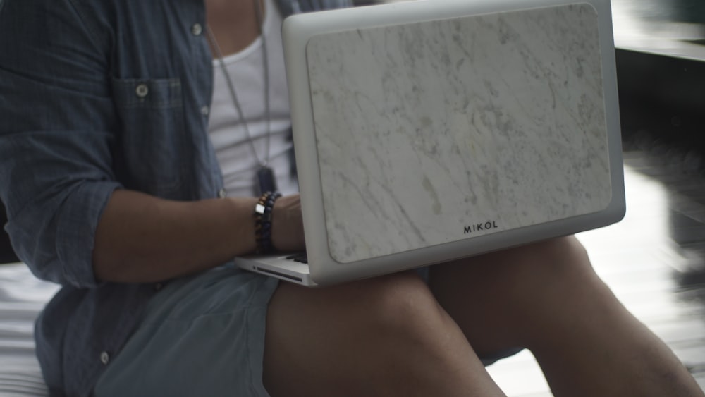 white samsung tablet computer on persons lap