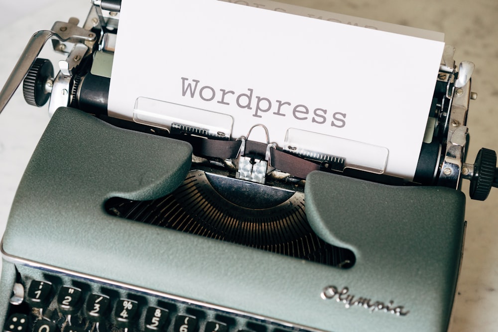 black typewriter on green table