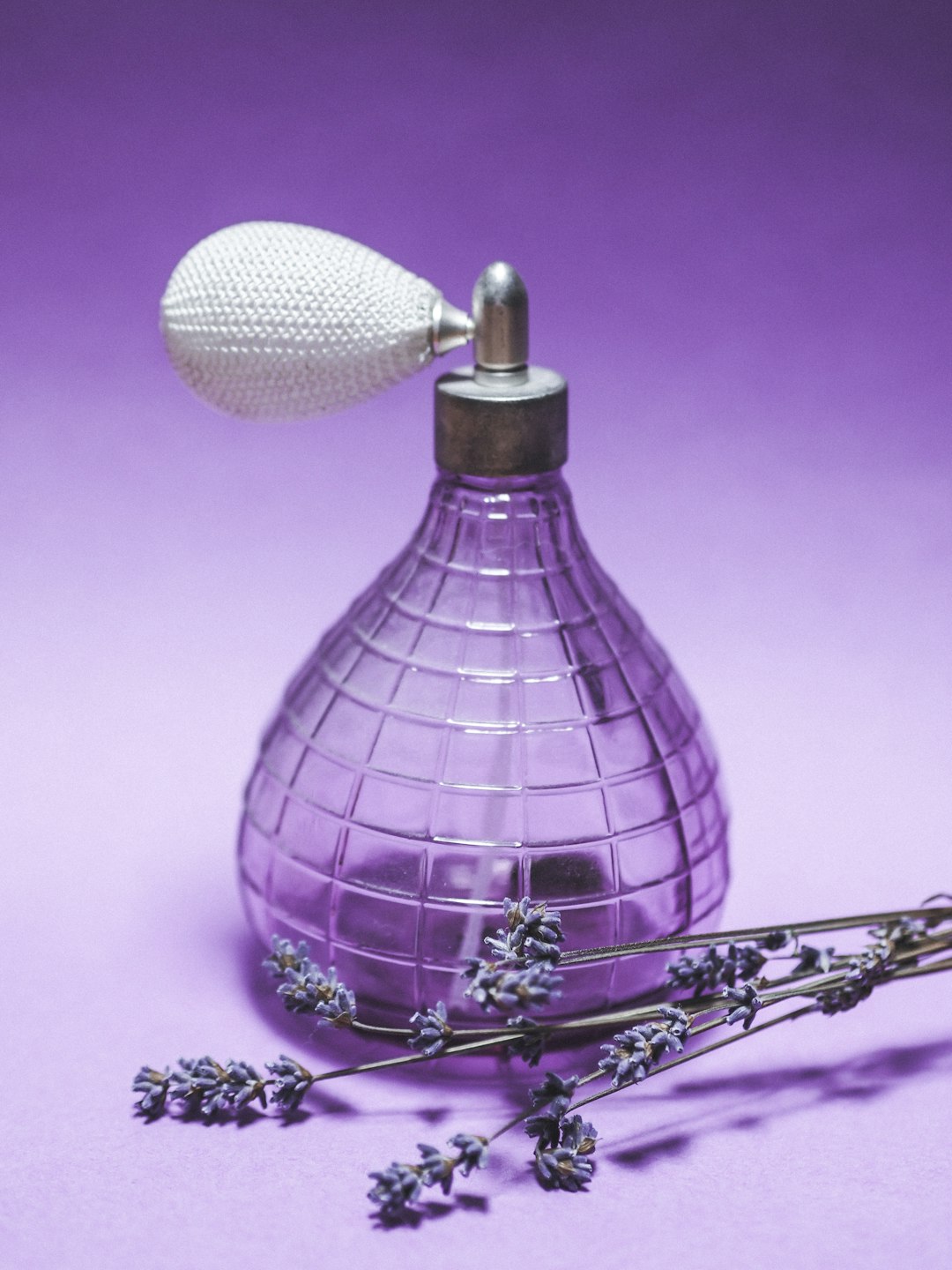 purple and white glass bottle