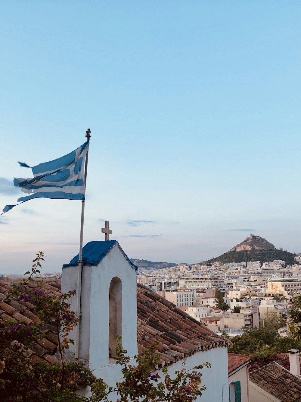 white and blue flag on top of building