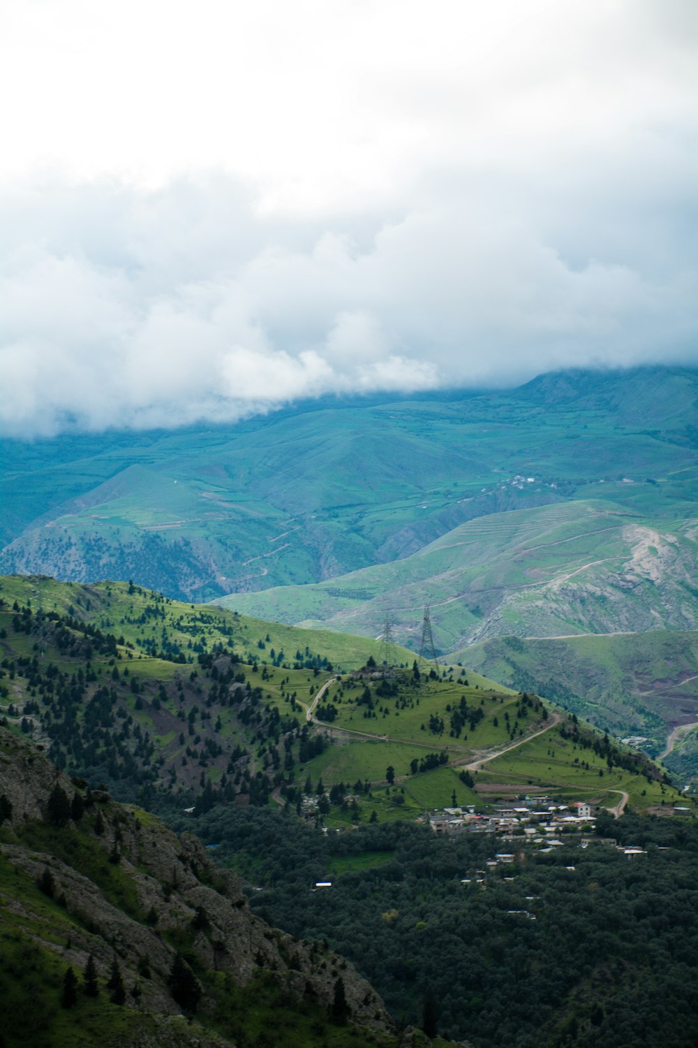 green mountains under white clouds during daytime