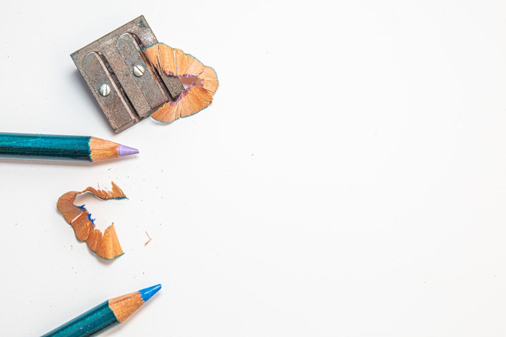 Colored pencils with sharpener Stock Photo by rezkrr