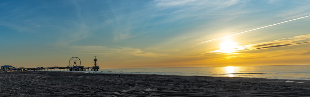 sea waves crashing on shore during sunset