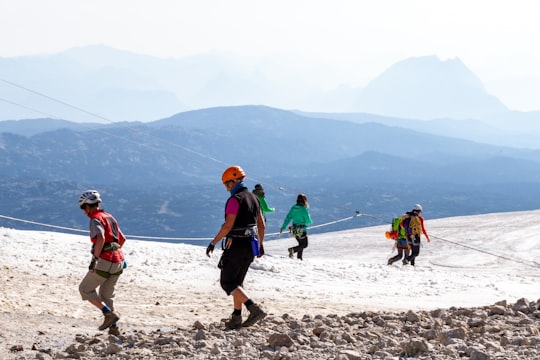 people walking on beach during daytime in Dachstein glacier Austria