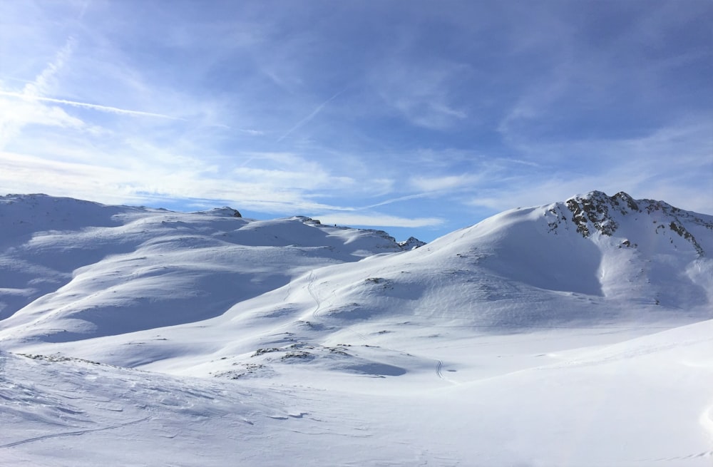 snow covered mountain under blue sky during daytime