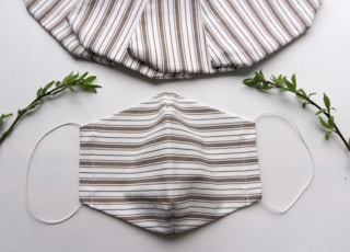 white and black striped textile