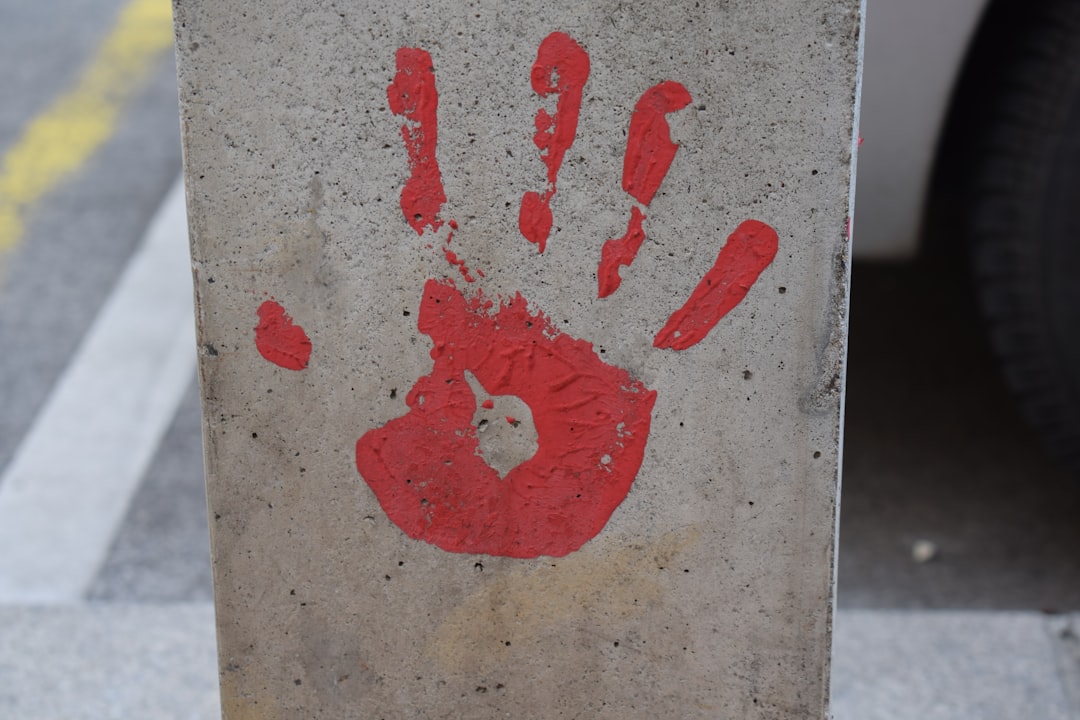 red heart drawing on grey concrete wall