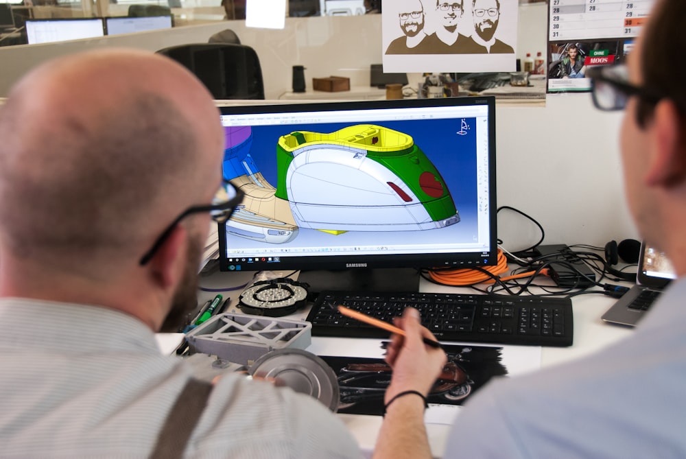 man in white shirt wearing black framed eyeglasses