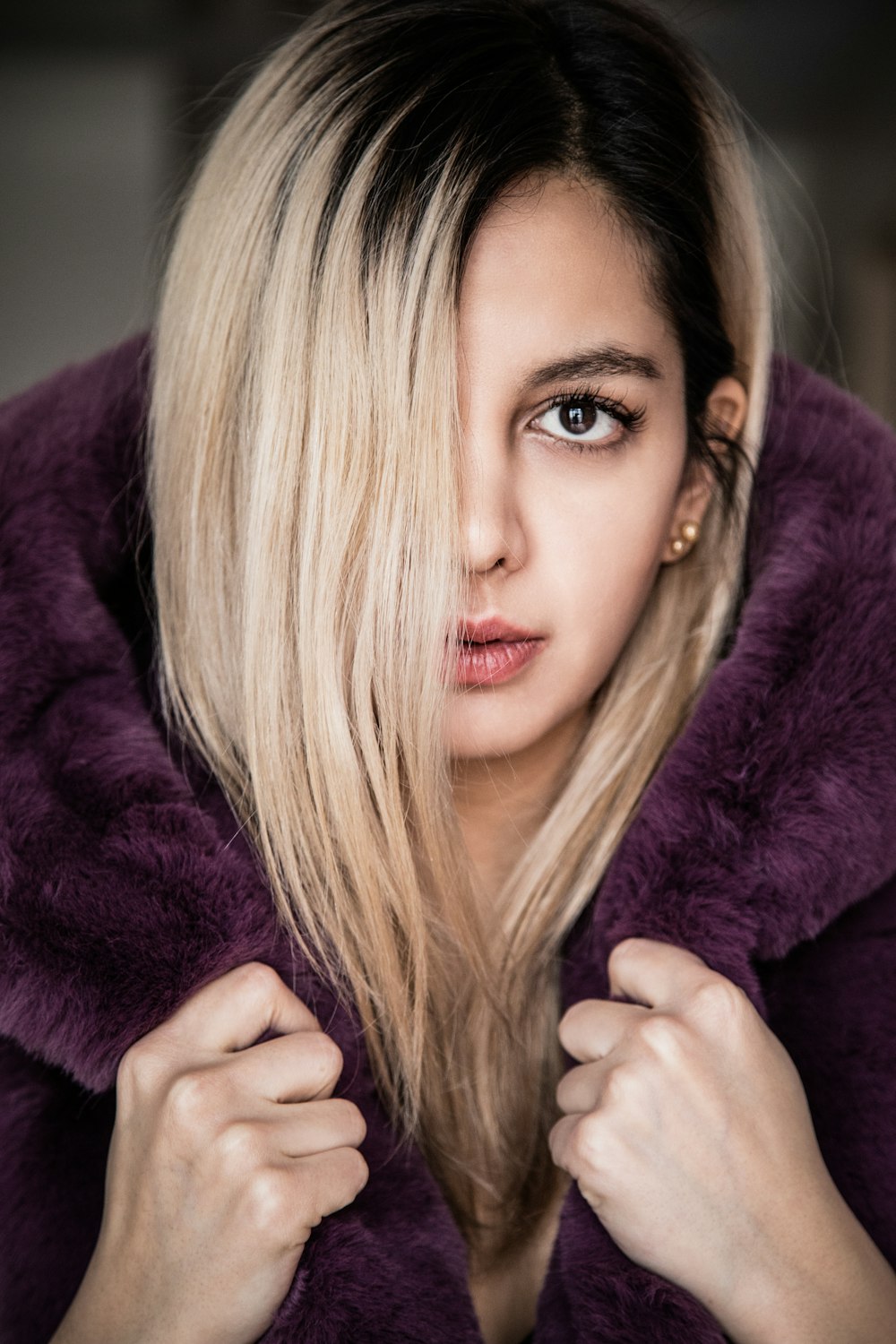 woman in purple fur coat