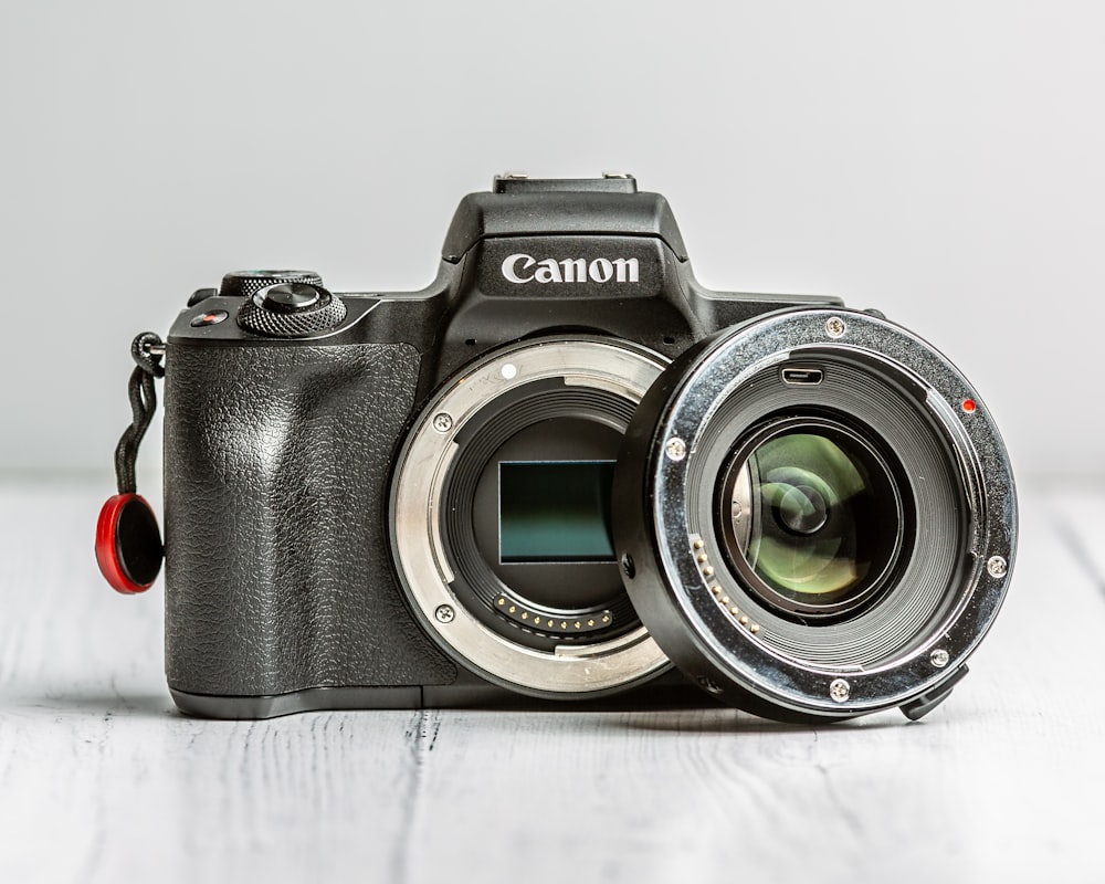 black and silver canon dslr camera