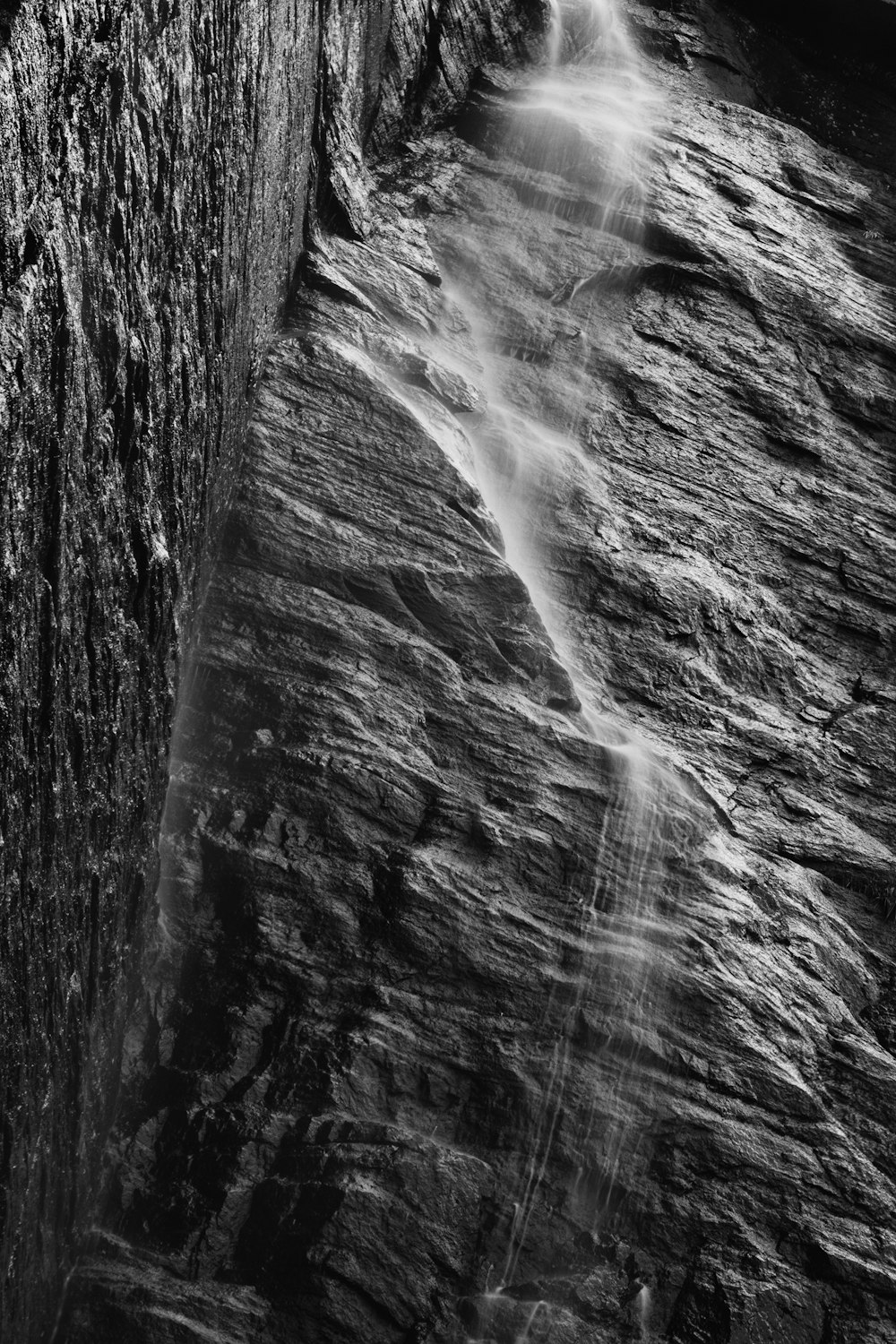 grayscale photo of water falls