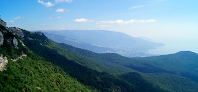 green mountains under blue sky during daytime federal colonial zoom background