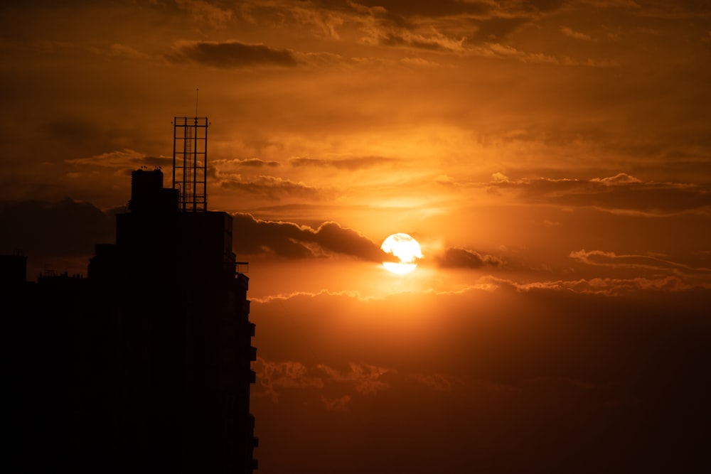 silhouette of building during sunset