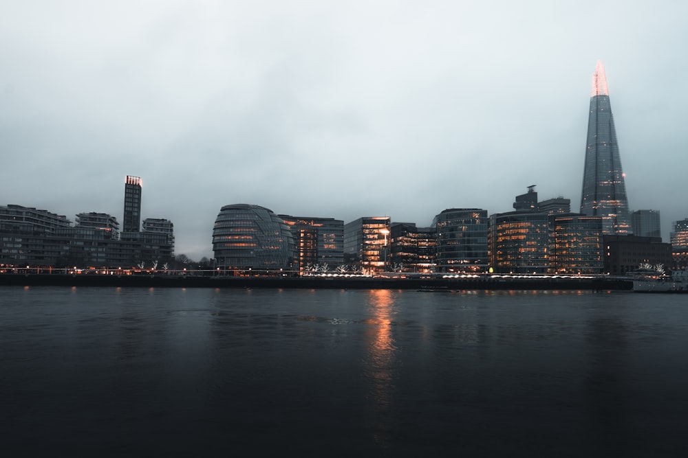 city skyline across body of water during daytime