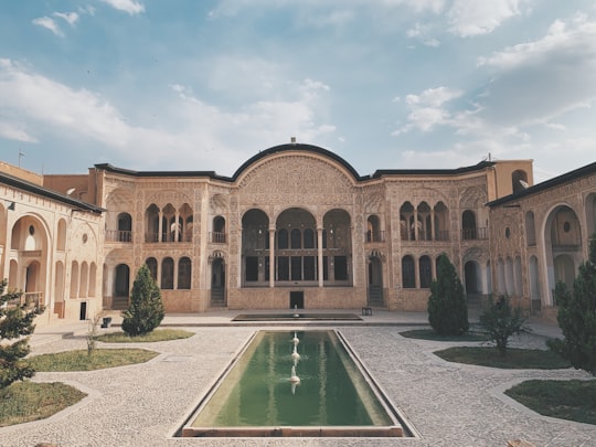 brown concrete building under blue sky during daytime in Tabatabaei Historical House Iran