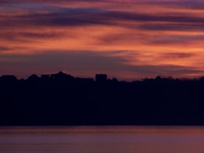 A peaceful sunset over a Levant village, evoking calm and hope for the future.
