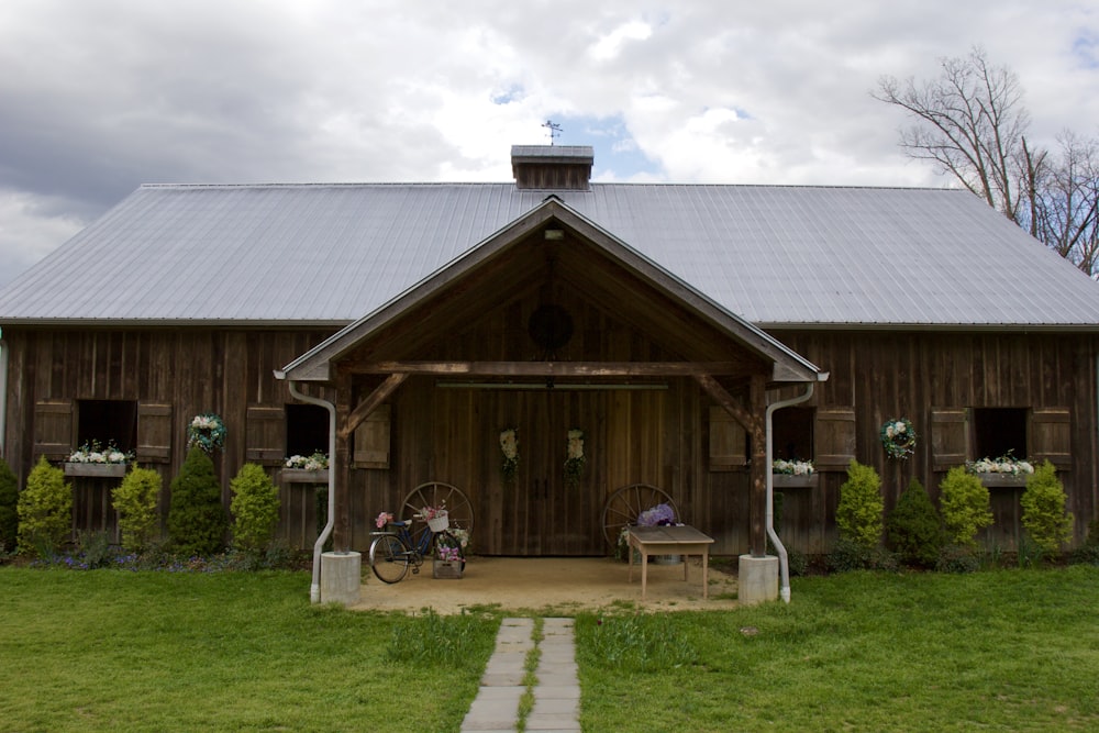 brown wooden house under white clouds during daytime