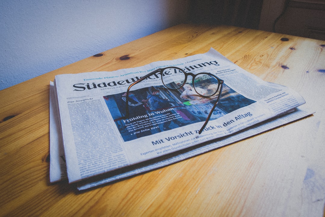 German newspaper "Süddeutsche Zeitung" with glasses during corona crisis 