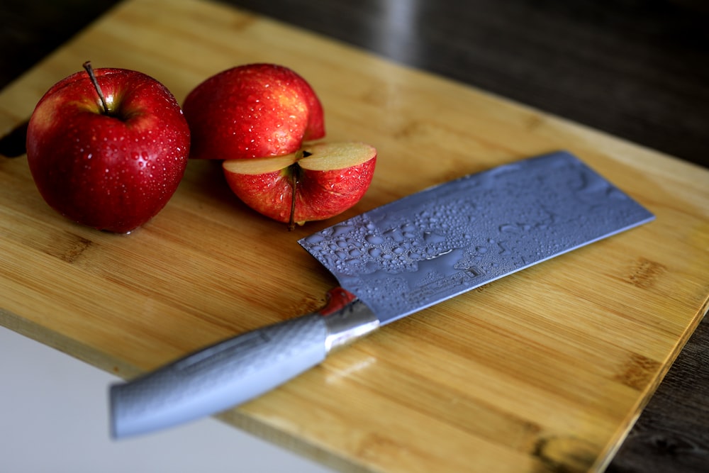 red apples on brown wooden table