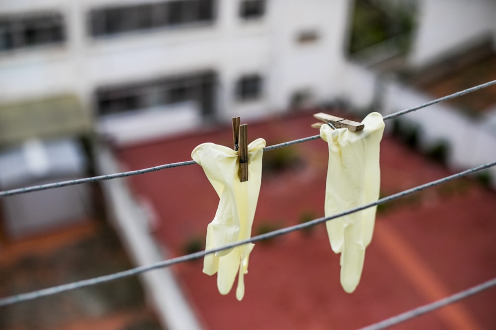 white and yellow clothes pin