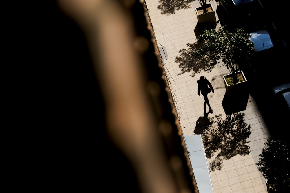 person walking on sidewalk during daytime