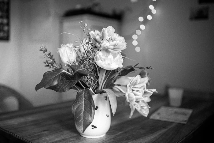 Grayscale photo of white flowers