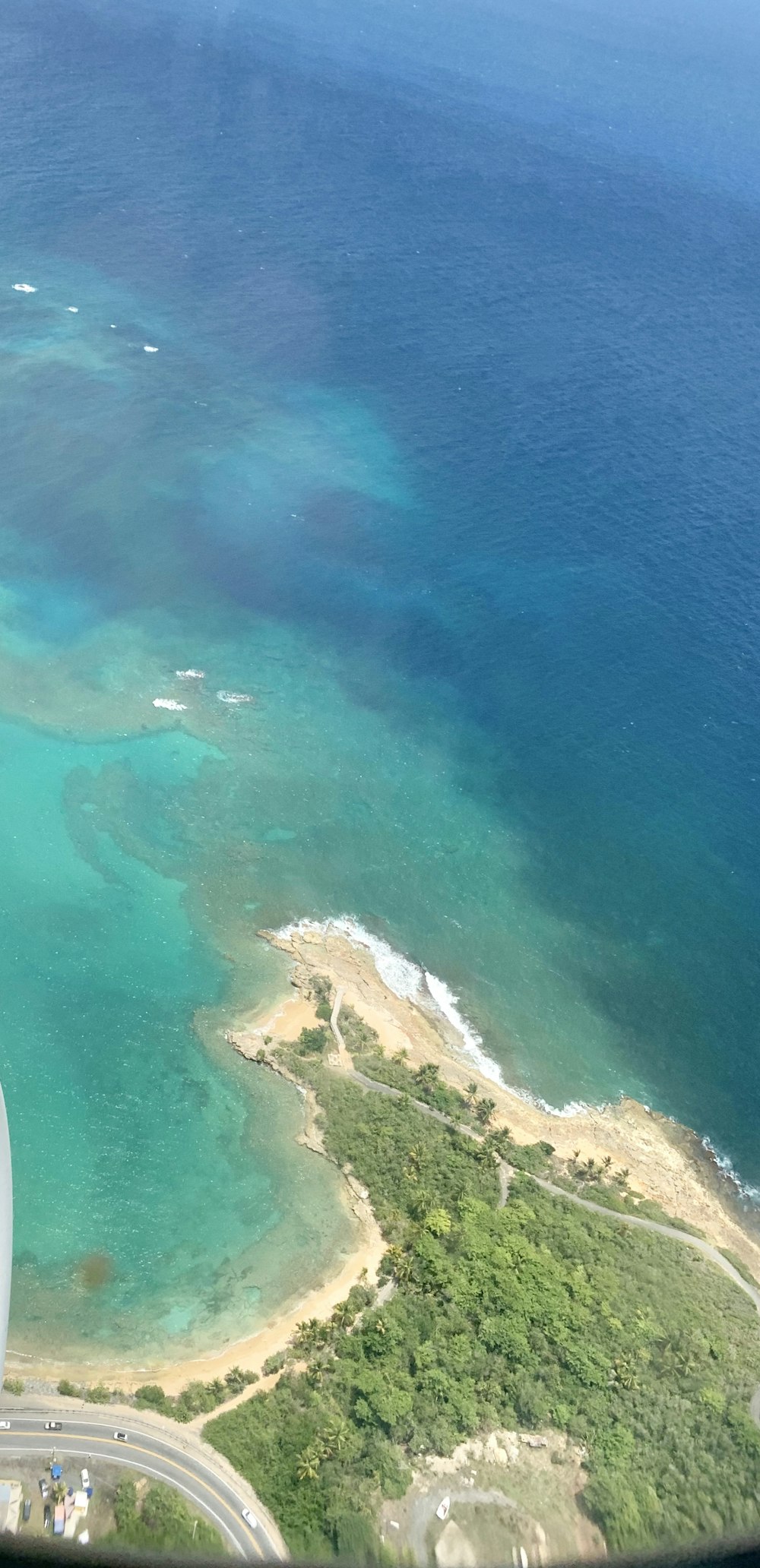 aerial view of green and brown island during daytime