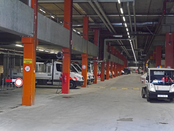 Rows of secure storage bays with various automobiles inside.