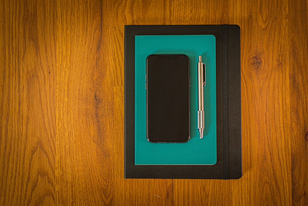 blue tablet computer case on brown wooden table