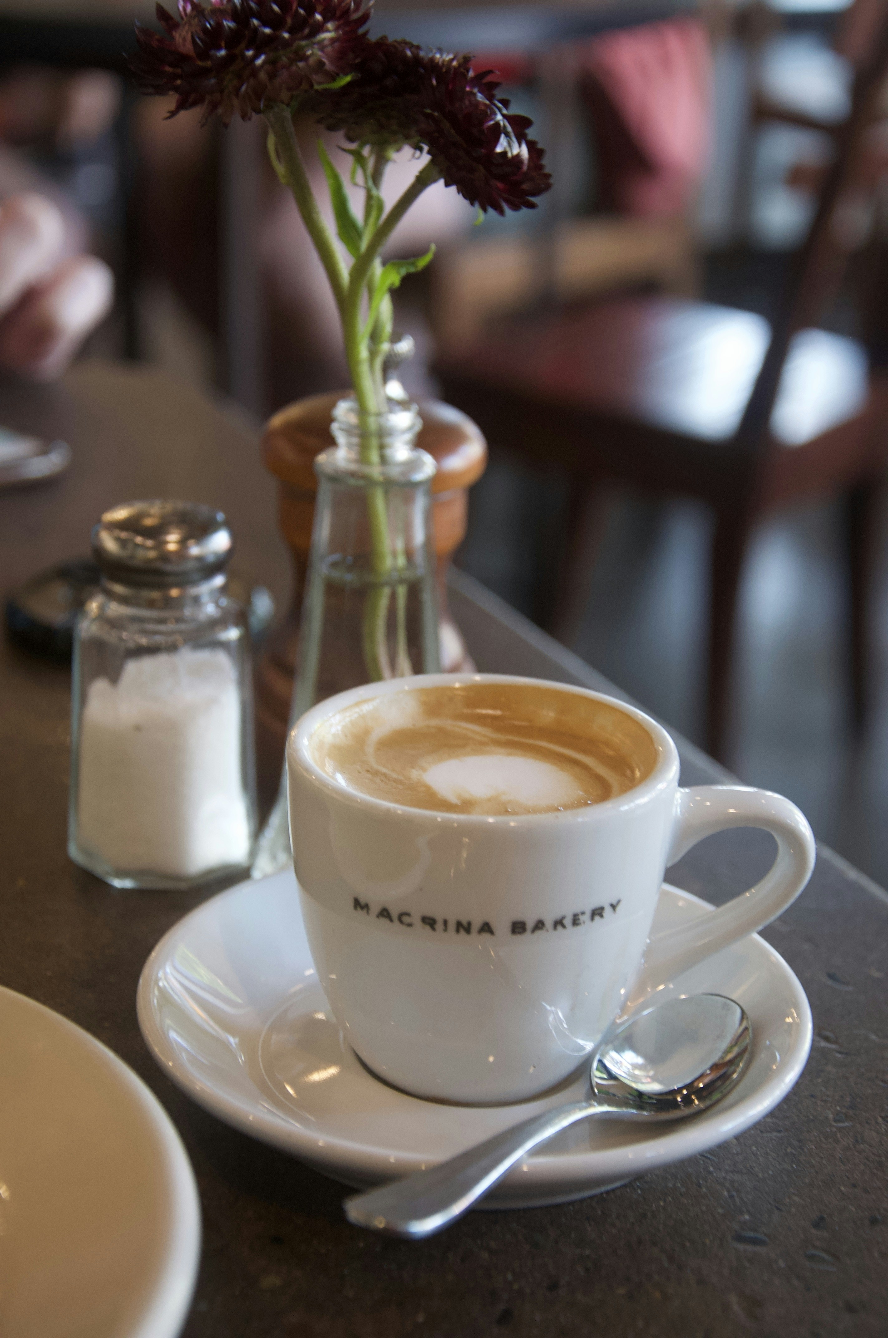 white ceramic cup with cappuccino