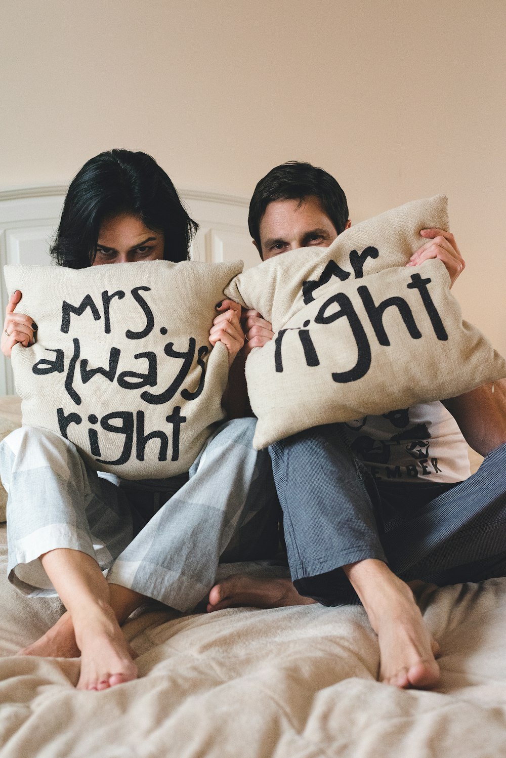 2 women sitting on couch