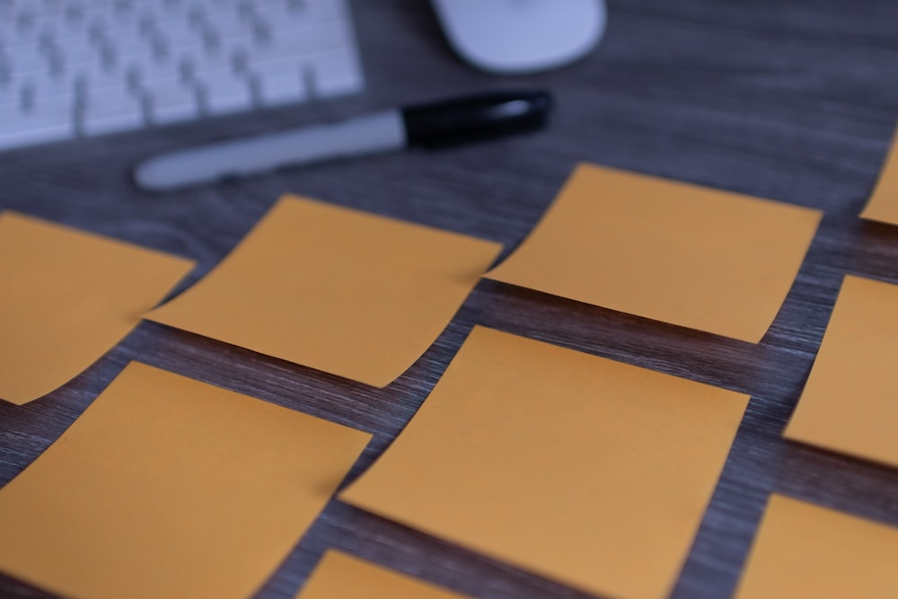 orange sticky notes on silver imac