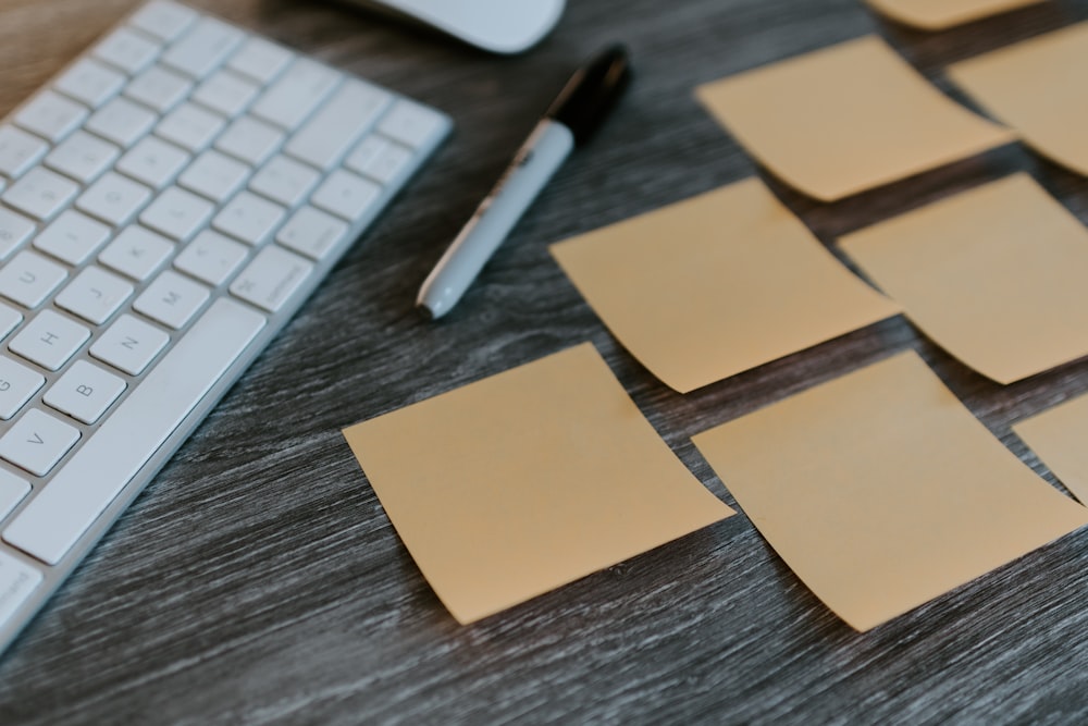 brown sticky notes on apple keyboard