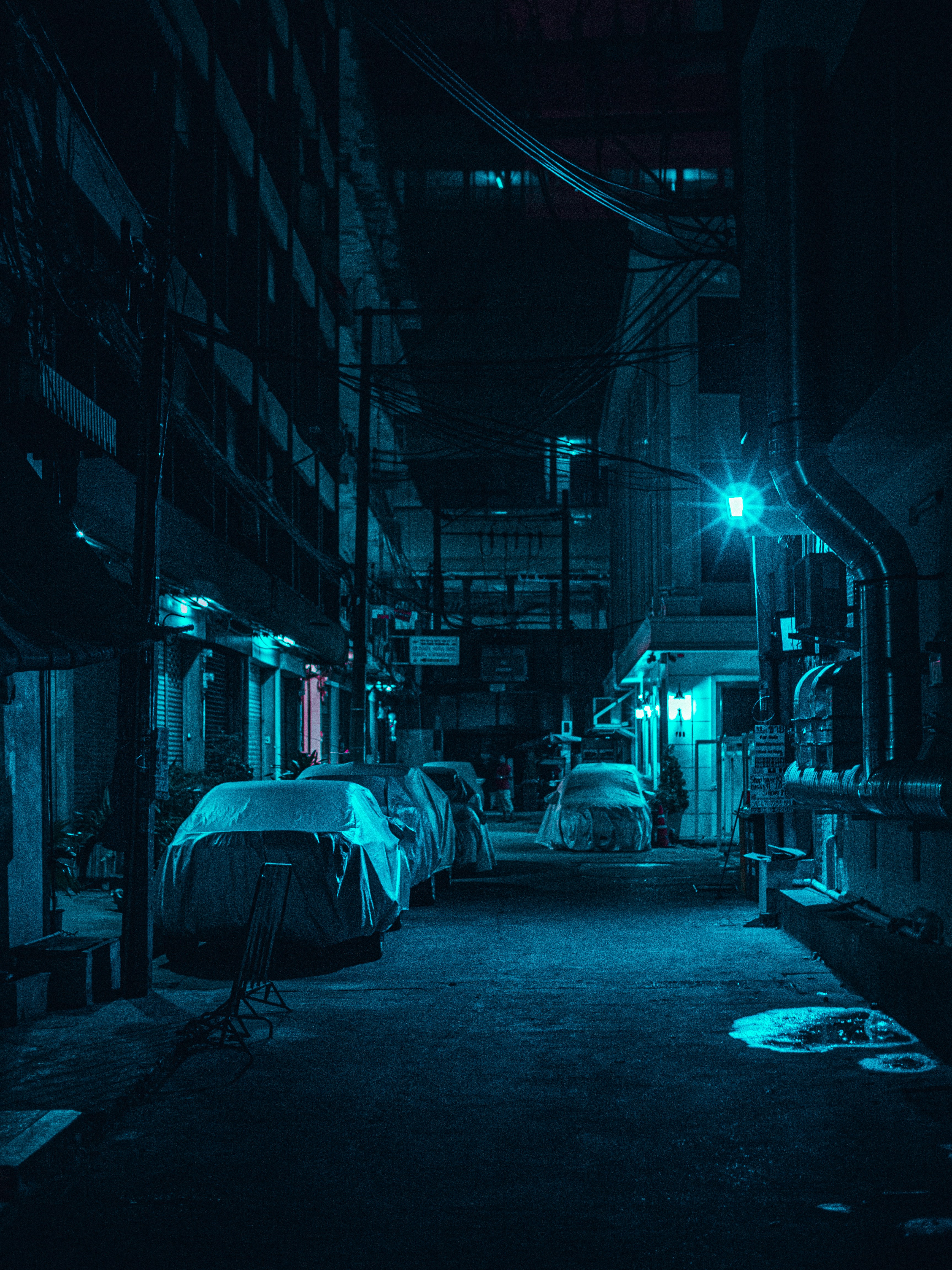 grayscale photo of man walking on street