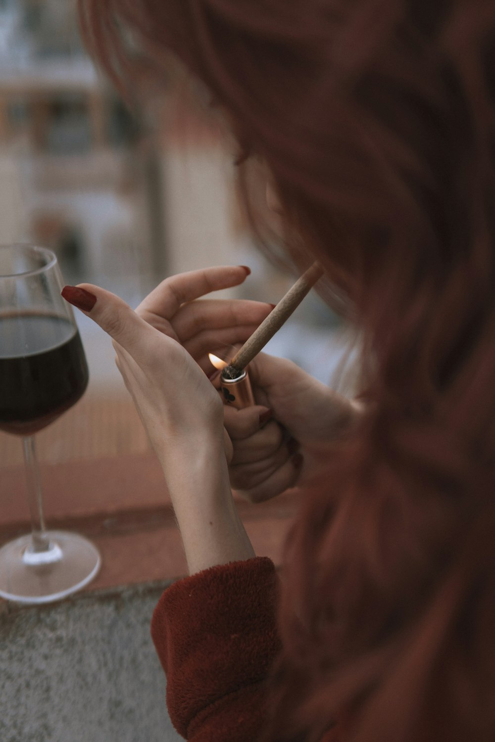 woman holding a wine glass