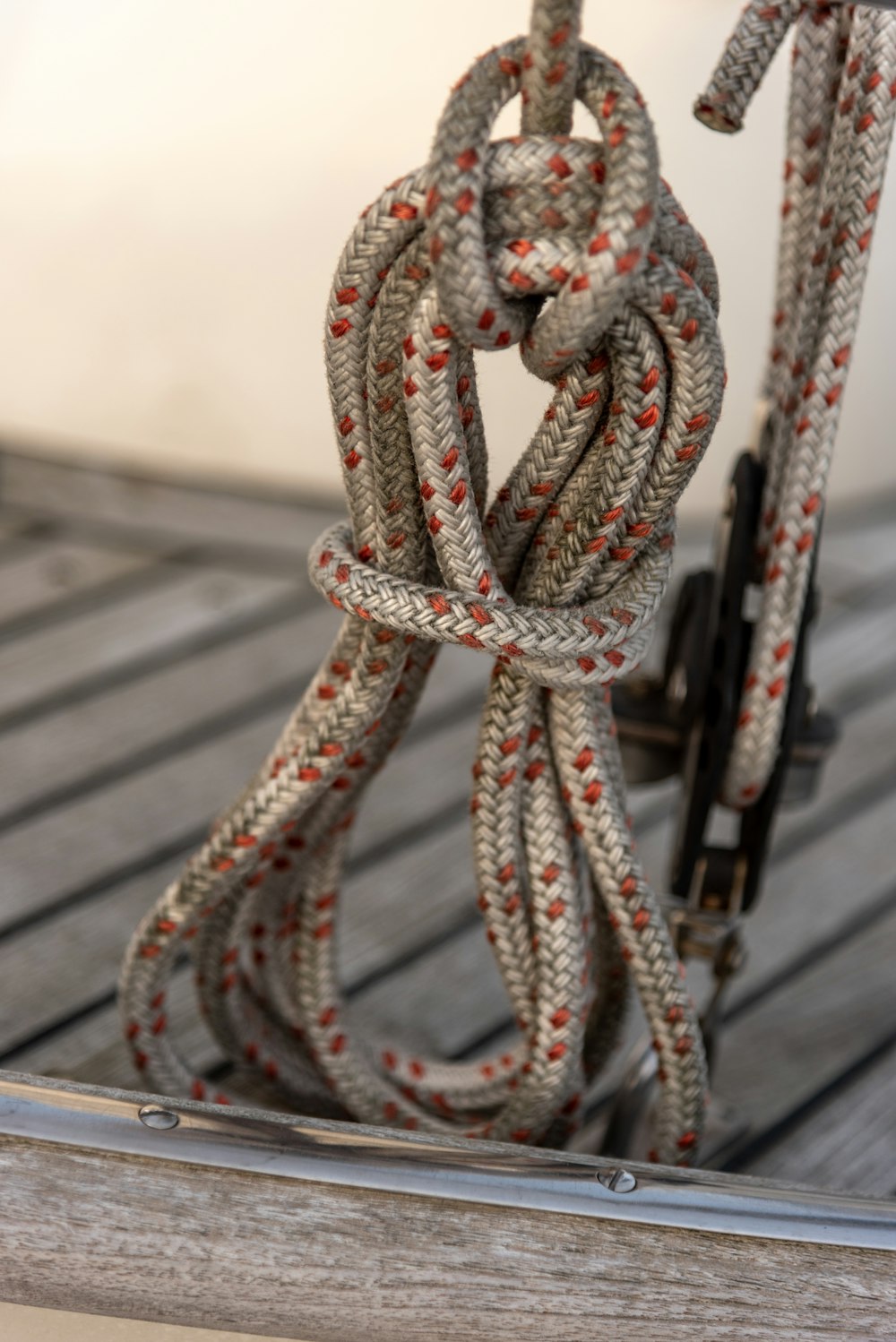 brown and white rope on black metal fence