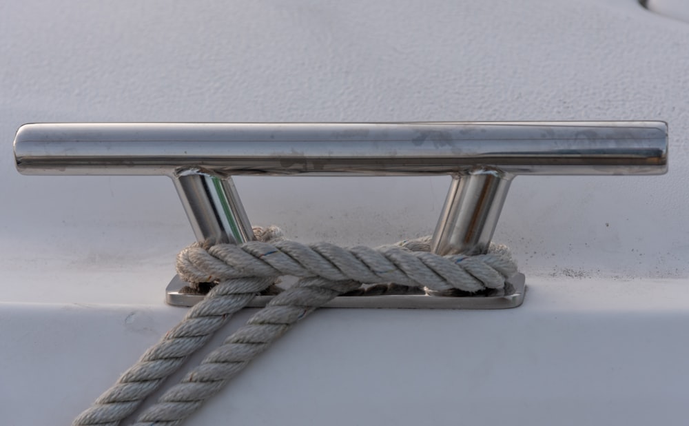 blue rope tied on stainless steel bar