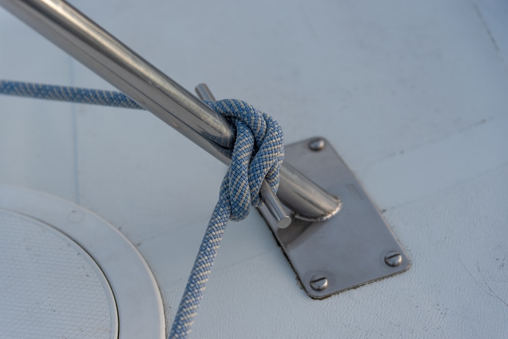 blue rope on silver steel door handle