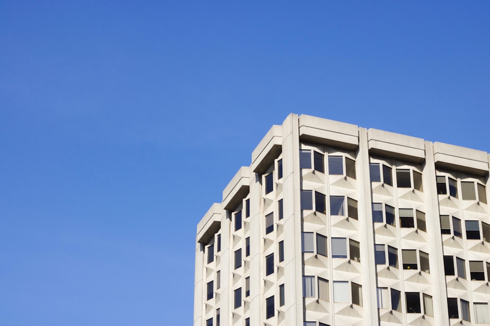 white concrete building under blue sky during daytime