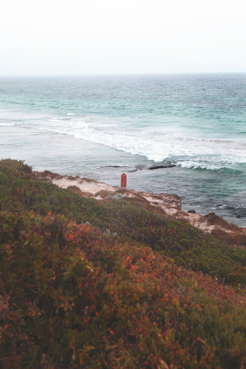 brown concrete tower near sea during daytime