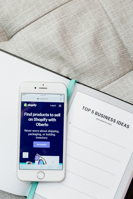 white samsung android smartphone on white paper