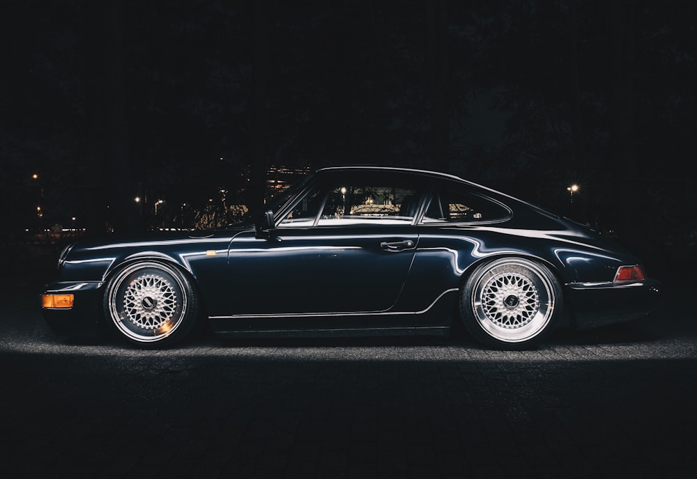 black porsche 911 on black background