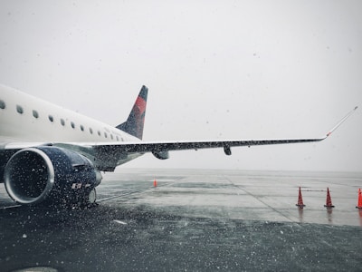 white passenger plane on airport during daytime
