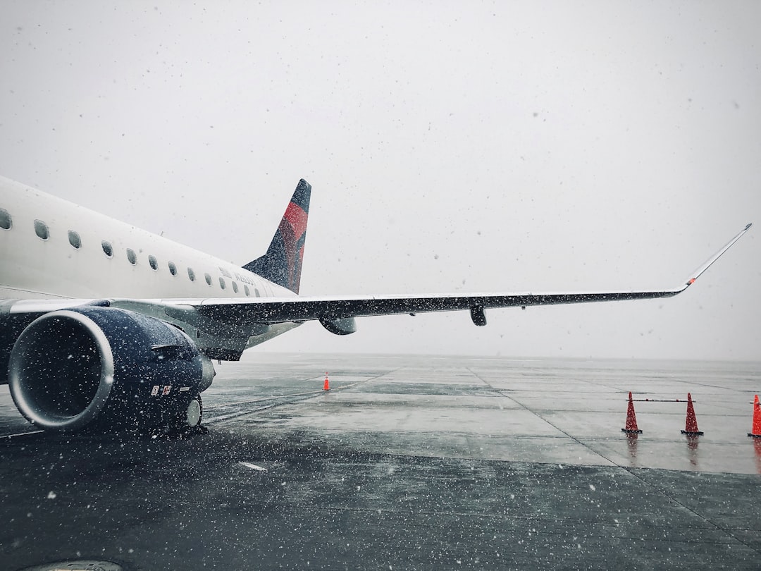 white passenger plane on airport during daytime,