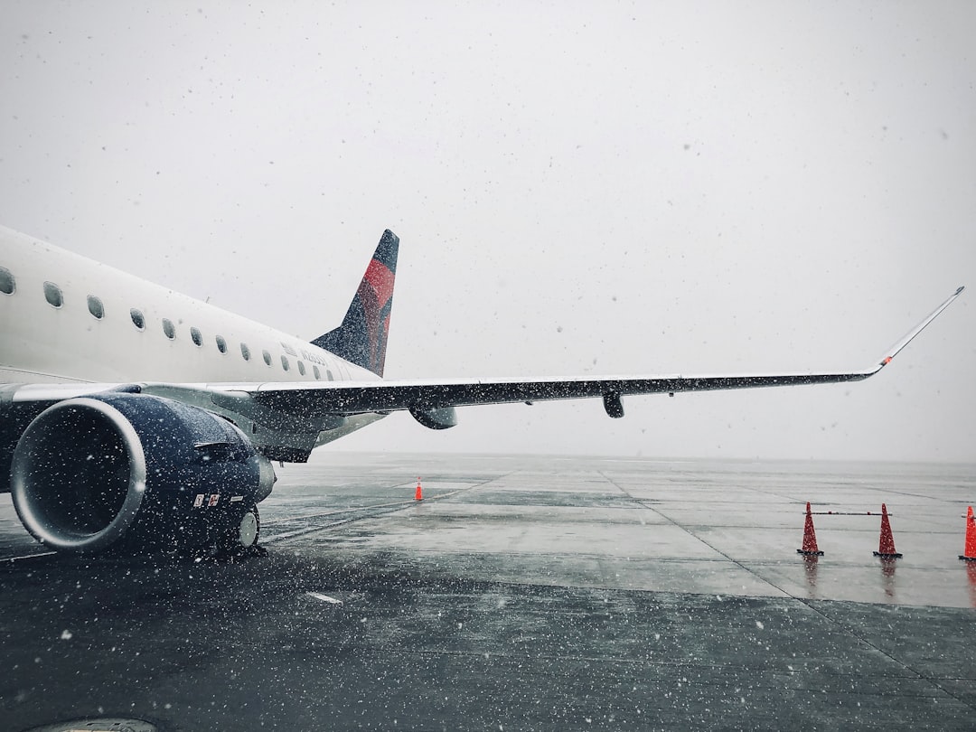 white passenger plane on airport during daytime