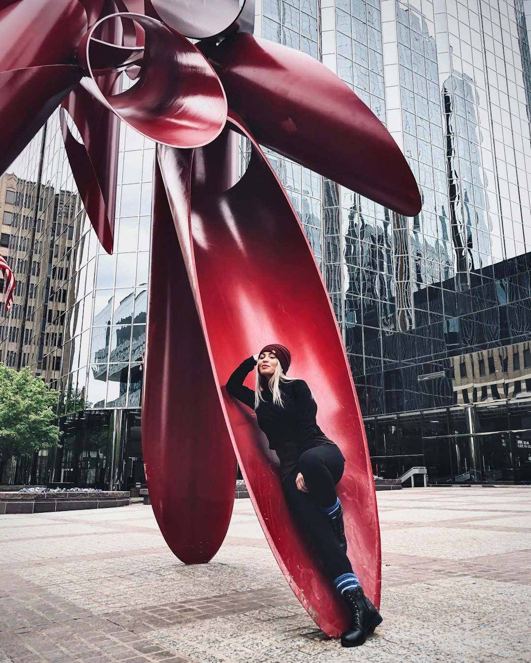 red and black statue near building during daytime