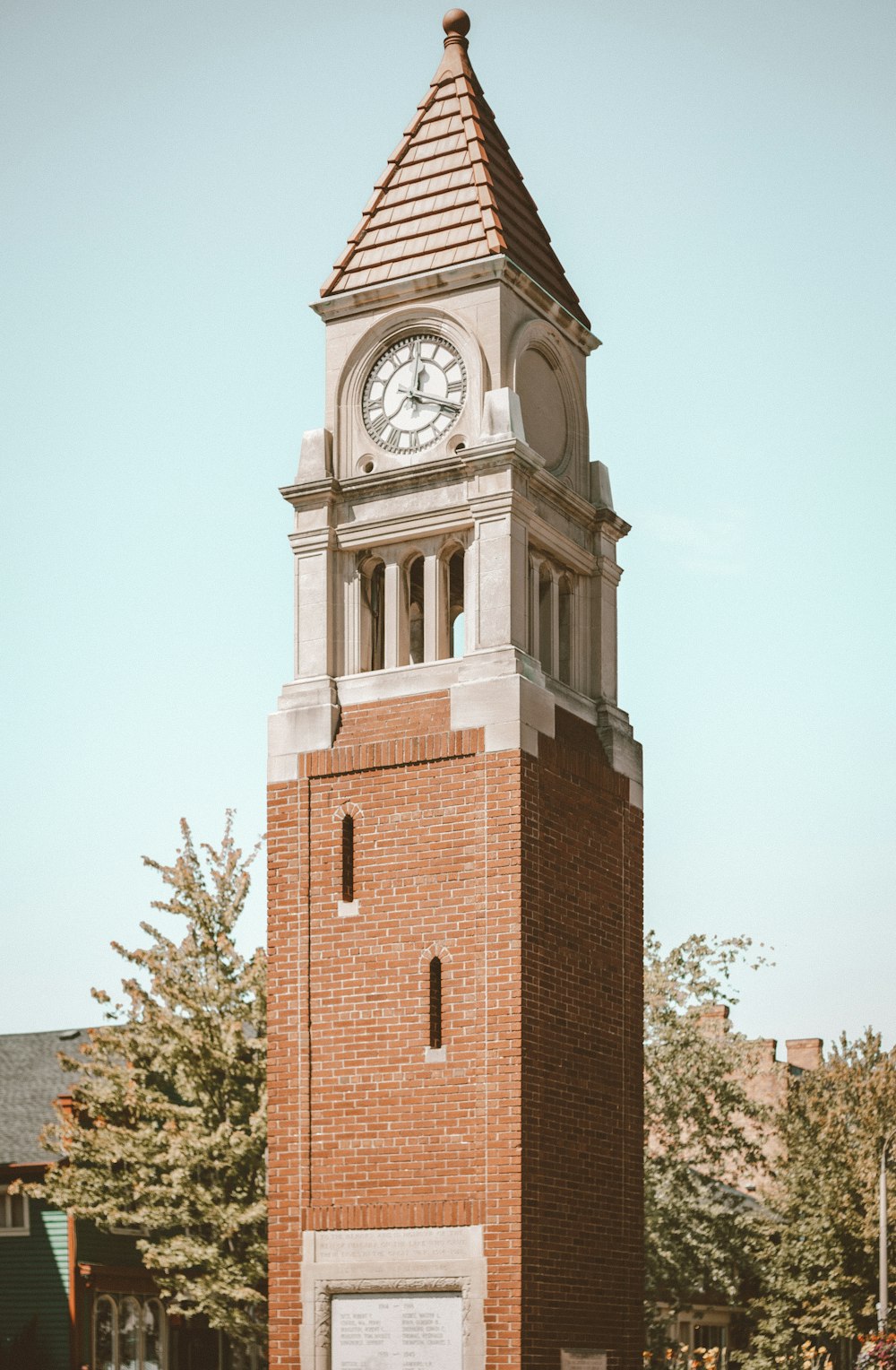 brown brick building with clock