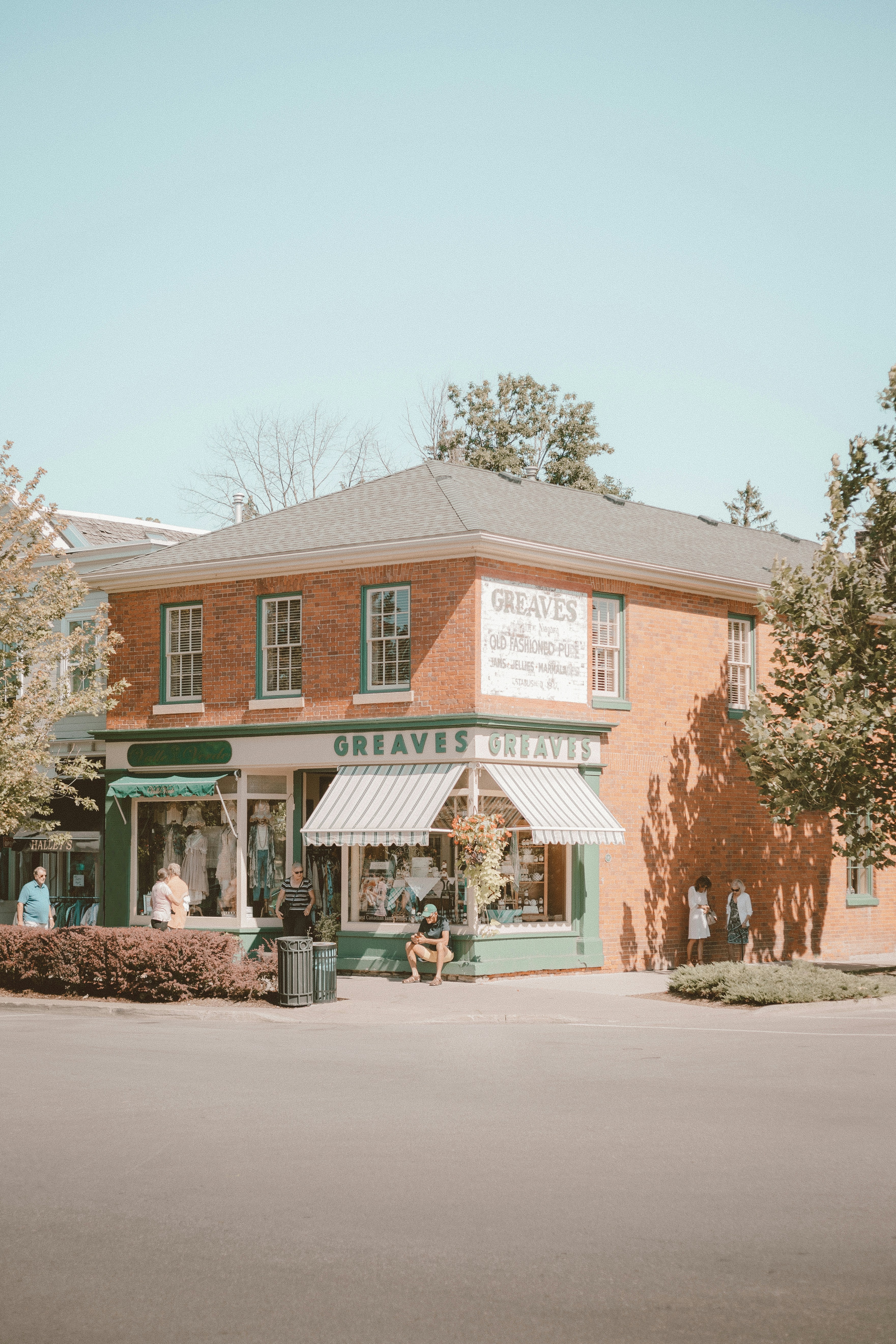 green and brown concrete building near green trees during daytime