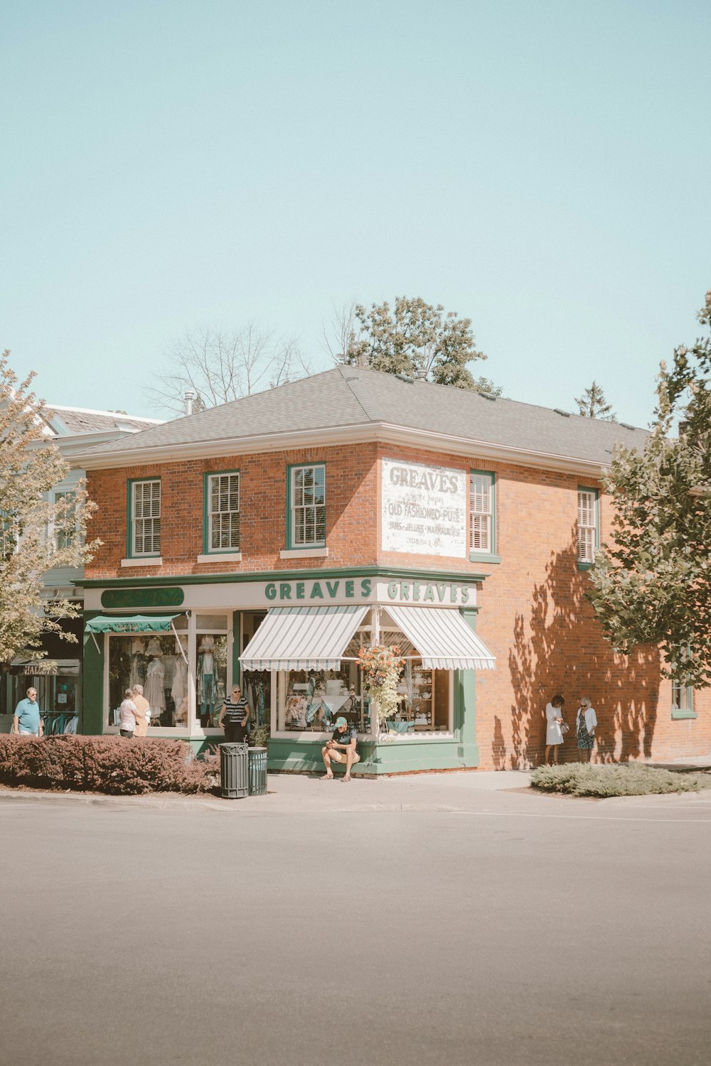 green and brown concrete building near green trees during daytime